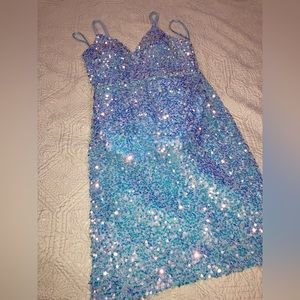 Medium, blue dress with rainbow reflective sequence, zipper, adjustable straps.